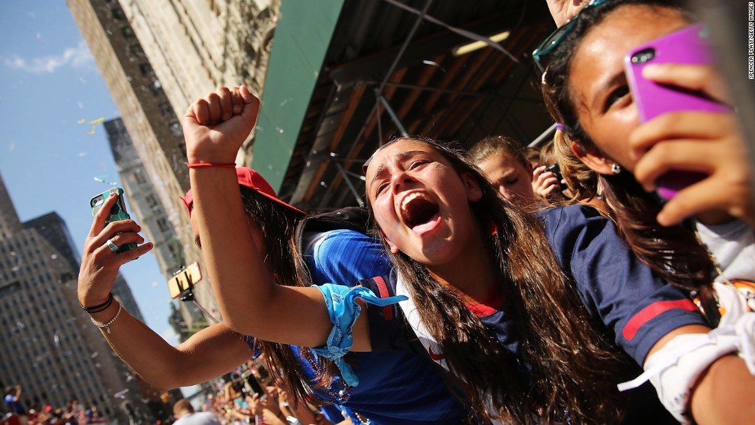 Fans cheer and take photos during the parade. The last time female athletes paraded along the Canyon of Heroes was in 1984.