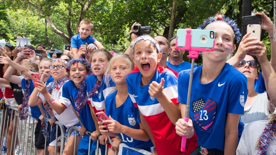 Young fans line the parade route. The cost of the parade is reportedly $2 million.