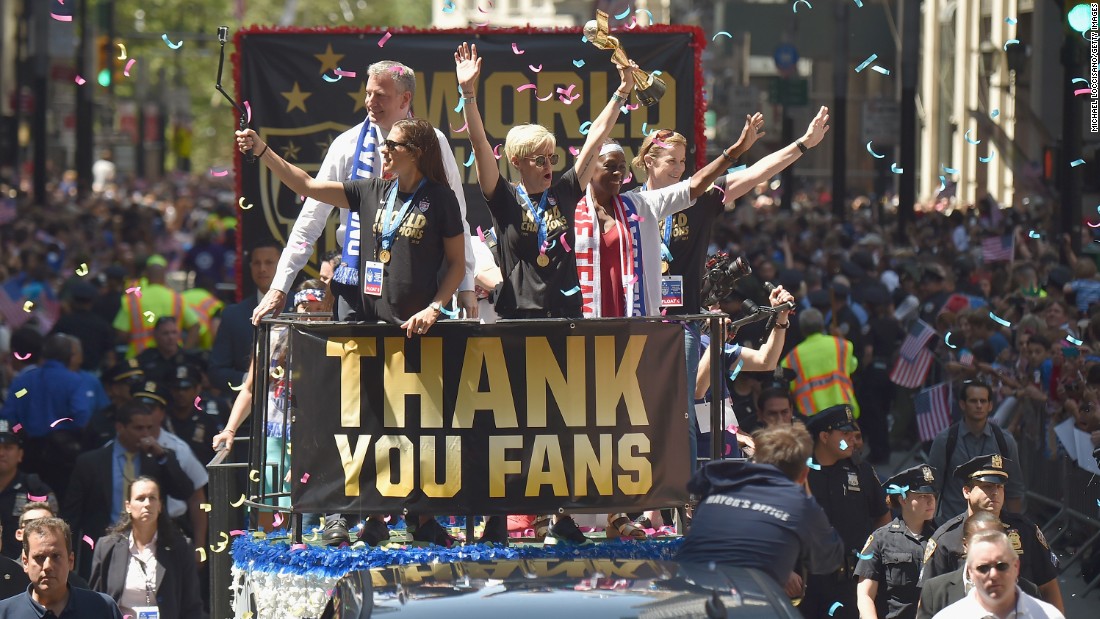 The U.S. women&#39;s soccer team celebrates its  World Cup victory with a ticker tape parade in New York on Friday, July 10. Midfielder Megan Rapinoe is holding the trophy.