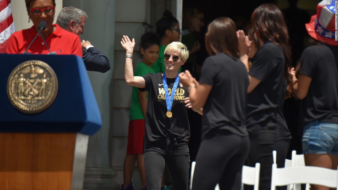 Robin Robbins, left, and Mayor Bill de Blasio celebrate soccer player Megan Rapinoe, center, and her fellow World Cup champions at City Hall. 