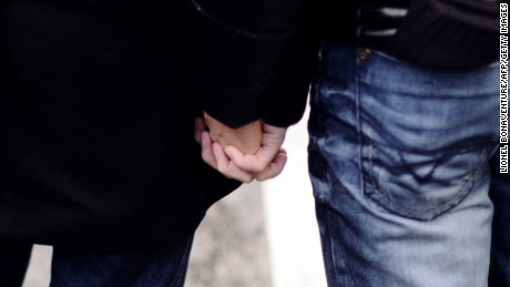 Outward displays of affection between same-sex couples, like these two men holding hands during a gay rights demonstration in Paris on December 16, 2012, are largely frowned upon in Russia.