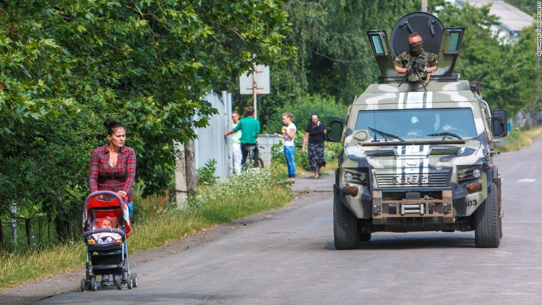 Ukrainian security forces patrol in the village of Bobrovyshche on July 14, 2015. More than 6,400 people have been killed in the conflict in Ukraine since April 2014, the United Nations says.