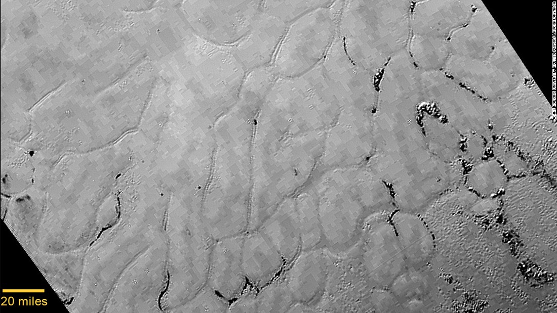 Images taken of Pluto&#39;s heart-shaped feature, informally named Tombaugh Regio, reveal a &quot;vast, craterless plain that appears to be no more than 100 million years old,&quot; NASA said July 17. The frozen region &quot;is possibly still being shaped by geologic processes.&quot; NASA&#39;s New Horizons spacecraft was launched in 2006 and traveled 3 billion miles to the dwarf planet.