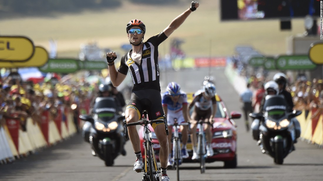 MTN-Qhubeka&#39;s Stephen Cummings celebrates as he crosses the finish line at the end of the 178,5 km 14th stage. It was the first Tour victory for an African team.