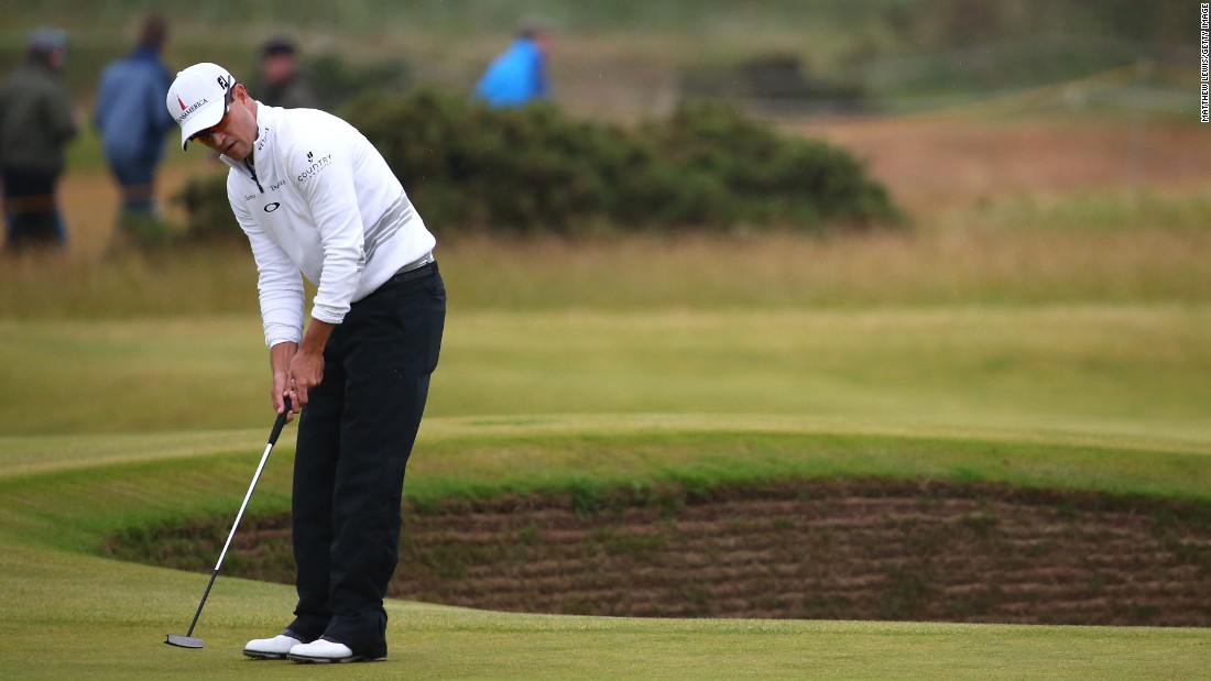 Here Johnson putts on the 14th green during the final round on The Old Course. The Open carries a $10,000,000 purse.