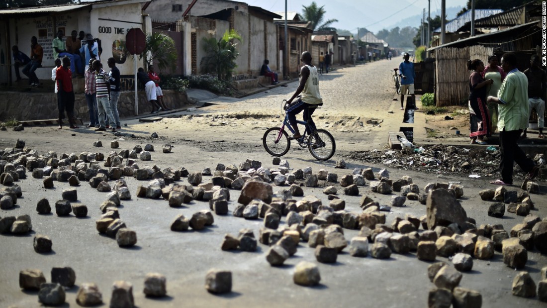 A man rides past a barricade set up by protesters in Bujumbura on July 21. Animosity against Nkurunziza &lt;a href=&quot;http://www.cnn.com/2015/05/14/world/gallery/burundi-unrest/index.html&quot; target=&quot;_blank&quot;&gt;boiled over in April&lt;/a&gt; when he expressed his intention to run for a third term. There have been protests and a failed coup.