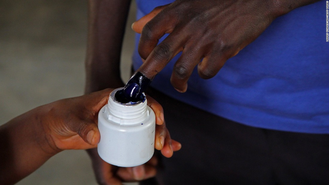 A man has his fingers inked in order to vote at a polling station in Bujumbura on July 21.