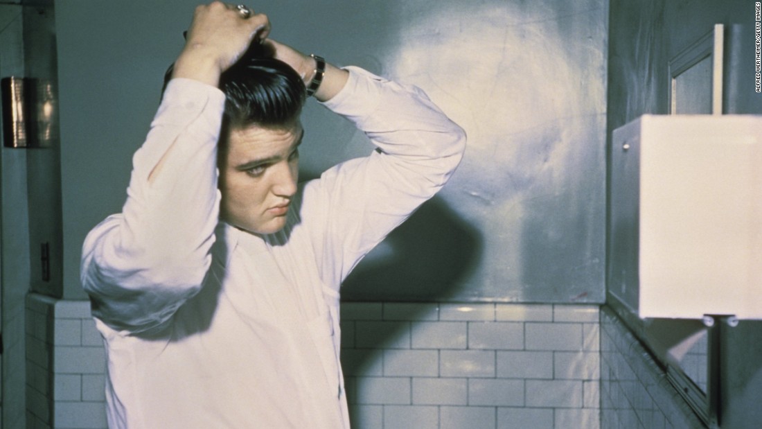 Elvis&#39; hair was naturally sandy blond, but &lt;a href=&quot;https://www.yahoo.com/beauty/elvis-presleys-hairstylist-spills-the-kings-secrets-88493562508.html&quot; target=&quot;_blank&quot;&gt;he liked to dye it black&lt;/a&gt; -- good for the image -- and keep it slicked back. His pompadour was a popular style in the 1950s.