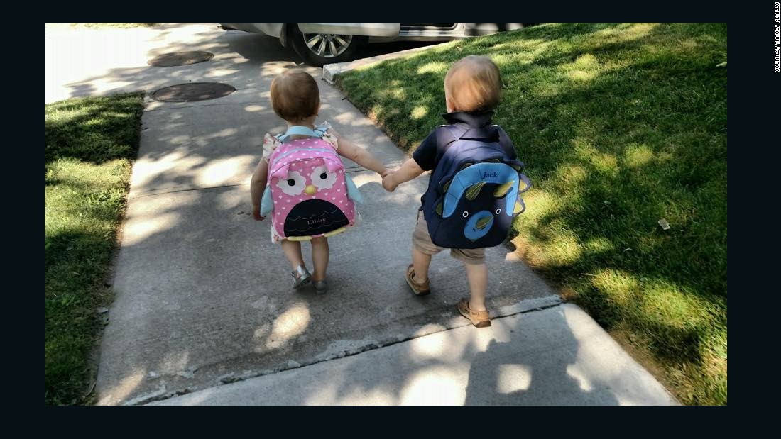 Twin siblings Jack and Libby, 20 months, keep each other close on their first day of school in Brookline, Massachusetts. 