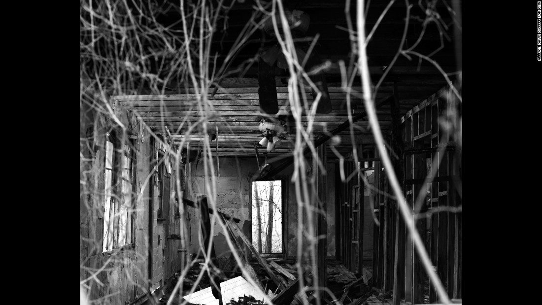 A light fixture remains intact on the inside of a home in the Lower Ninth Ward. 