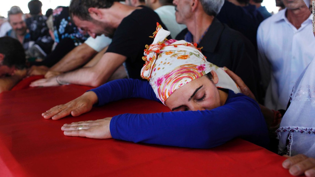 Mourners in Gaziantep, Turkey, grieve over a coffin Tuesday, July 21, during a funeral ceremony for the victims of a suspected ISIS suicide bomb attack. &lt;a href=&quot;http://www.cnn.com/2015/07/20/world/turkey-suruc-explosion/&quot;&gt;That bombing killed at least 31 people&lt;/a&gt; in Suruc, a Turkish town that borders Syria. Turkish authorities blamed ISIS for the attack.