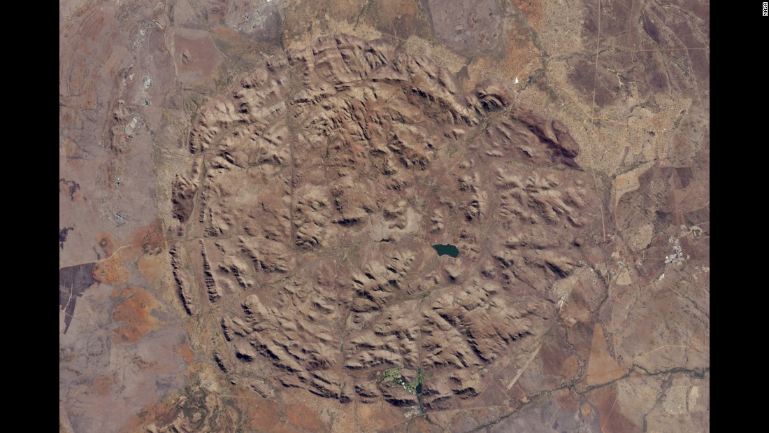 Pilanesberg National Park in North West Province, South Africa, is located in one of the world&#39;s largest and best-preserved alkaline ring dike complexes. The circular features were created by an ancient volcano. This image was taken by NASA&#39;s Landsat 8 satellite on June 19. Most of the streams that run through the valleys have dried up, but man-made dams have trapped water for the park&#39;s wildlife. The structure sits about 300 to 1,600 feet (100 to 500 meters) above the surrounding landscape.
