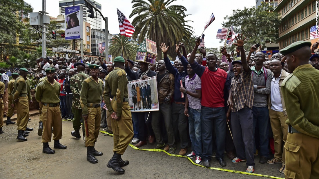 Crowds gather near Memorial Park in Nairobi to cheer Obama&#39;s motorcade on July 25.