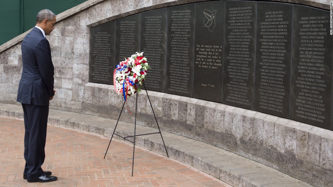 Obama pays his respects after laying a wreath at the Memorial Park in Nairobi on July 25. The park commemorates the 1998 truck bombing of the U.S. Embassy there, which killed a dozen Americans and more than 200 Kenyans. Almost simultaneously, 11 people were killed in a similar attack on the U.S. Embassy in Tanzania&#39;s capital.