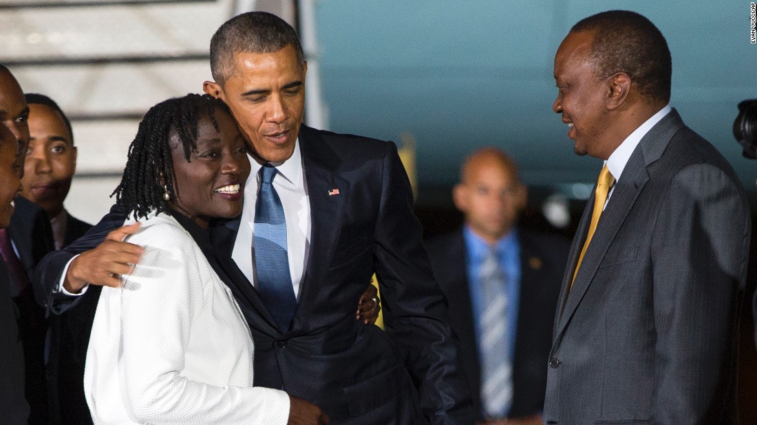 Kenyatta watches as Obama hugs his half-sister Auma on July 24.