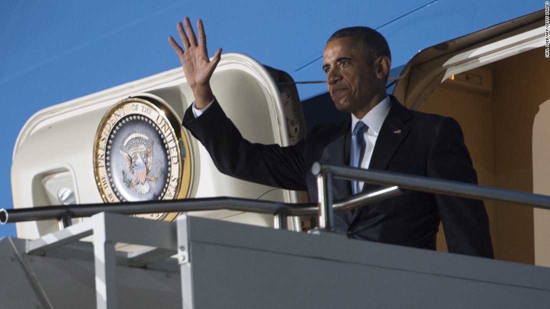 Obama waves from the door of Air Force One after arriving in Kenya on July 24.