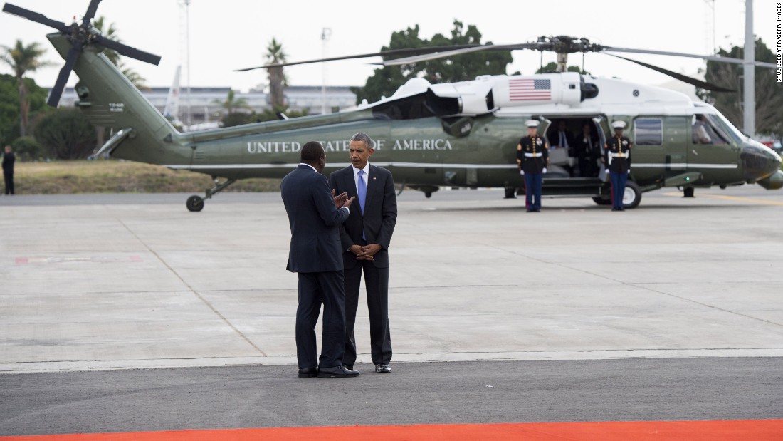 Obama talks with Kenyan President Uhuru Kenyatta in front of Marine One in Nairobi on July 26. The U.S. President called on Kenya&#39;s leaders to reject ethnic divisions and government corruption.