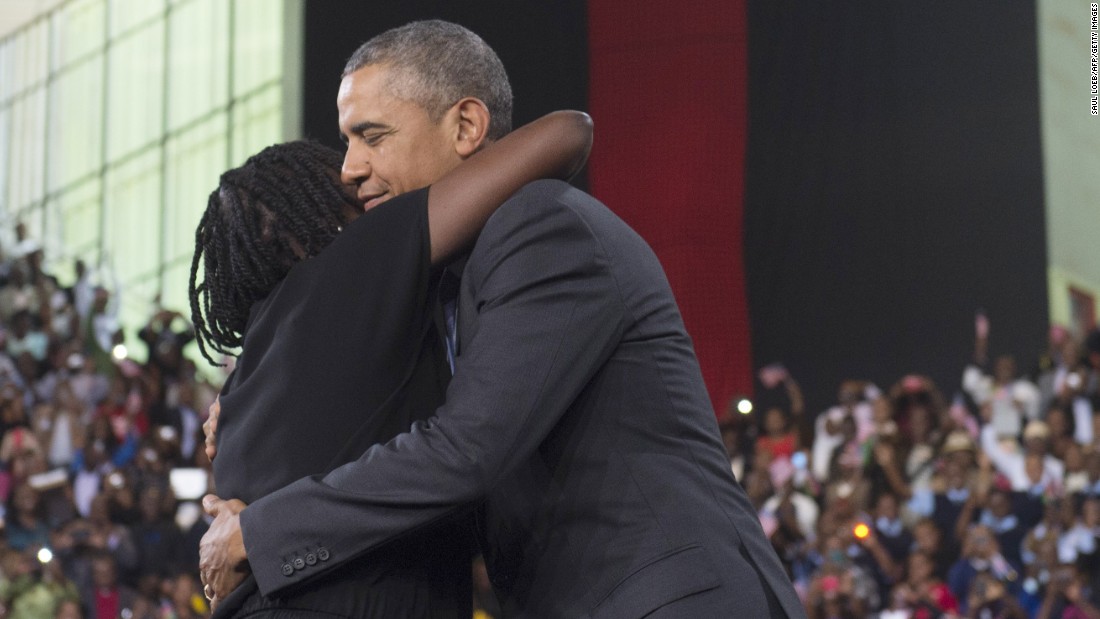 Obama embraces his half-sister Auma Obama during an event at the Moi International Sports Center on July 26. She introduced Obama to the crowd, saying her brother &quot;continues to be very attached to us.&quot; The President spent portions of each night in Kenya with relatives.