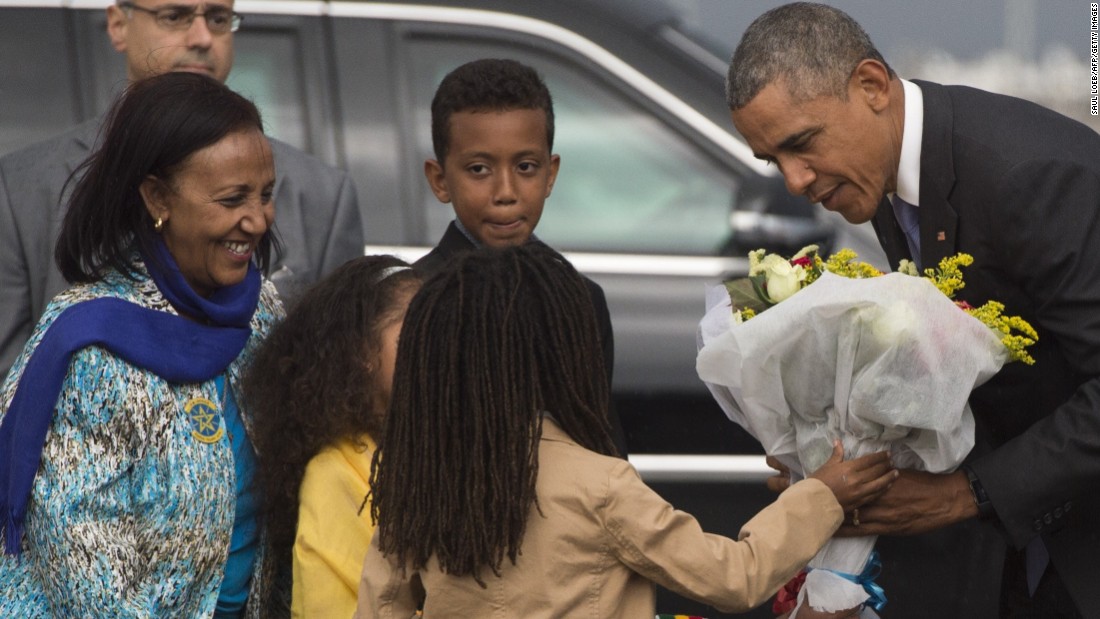 Obama receives flowers Sunday, July 26, upon his arrival at Bole International Airport in Addis Ababa.