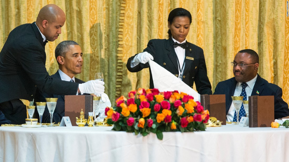 Obama and Ethiopian Prime Minister Hailemariam Desalegn are waited on during a state dinner Monday, July 27, at the National Palace in Addis Ababa.