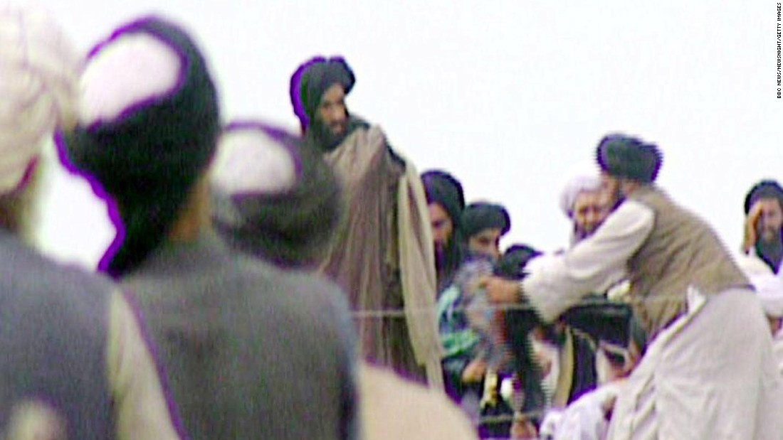 In this image taken off television by BBC Newsnight, Omar -- fourth from left -- attends a rally with Taliban troops before their victorious assault on Afghanistan&#39;s capital, Kabul, in 1996. The Taliban&#39;s aim is to impose its interpretation of Islamic law on Afghanistan and remove foreign influence from the country. Most of its members are Pashtun, the largest ethnic group in Afghanistan.