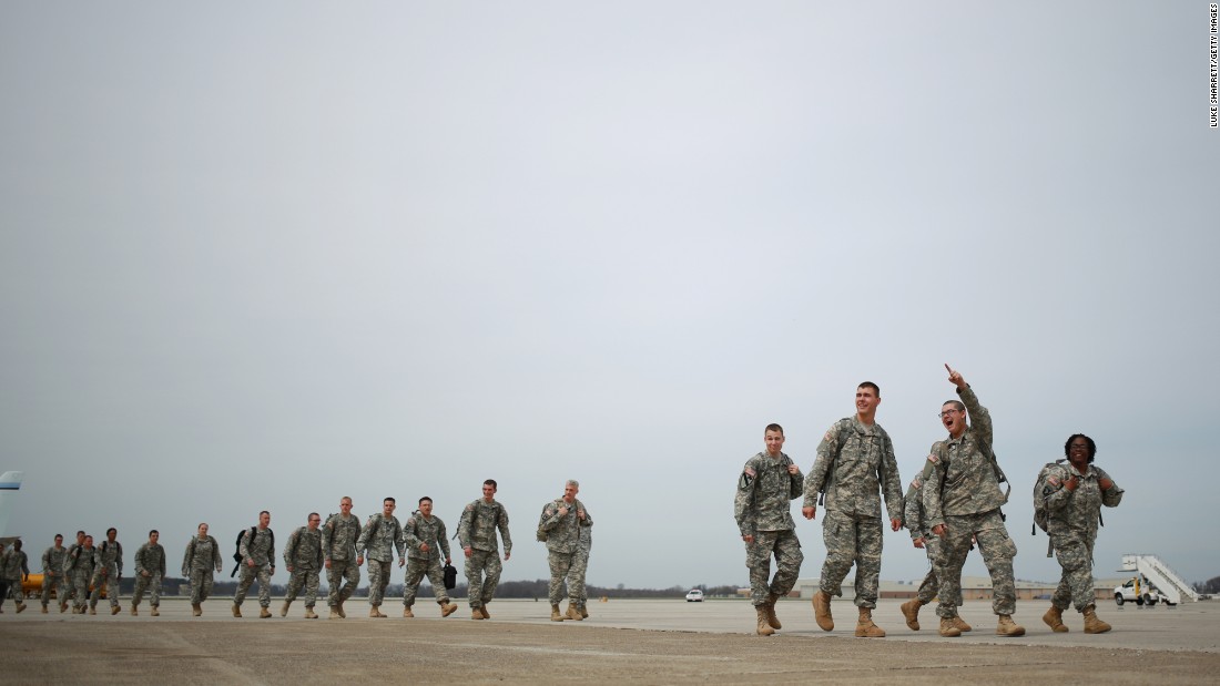 Soldiers from the U.S. Army&#39;s 101st Airborne Division walk across the tarmac at Campbell Army Airfield before reuniting with their families at a homecoming ceremony March 21, 2015 in Fort Campbell, Kentucky. The 162 soldiers were deployed in Liberia, where they helped fight the spread of Ebola.