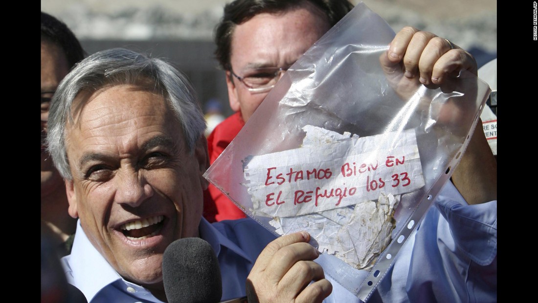 Chilean President Sebastian Pinera holds up a plastic bag containing a message from the miners on August 22. Translated from Spanish, it read: &quot;We are OK in the refuge, the 33.&quot; The miners were confirmed to be alive when rescue teams reached them via a tube that was sent down a small hole. The same hole was used to provide the miners with food, supplies and letters.