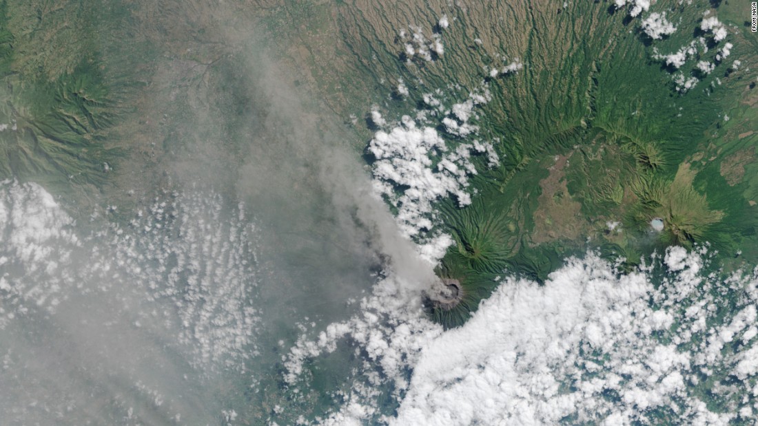 Ash and volcanic gases rise from the Mt. Raung volcano&#39;s caldera and drift northwest on the Indonesian island of Java. This image was captured by the Landsat 8 satellite on July 27. Mount Raung erupted at least 13 times in the past 25 years, according to the Smithsonian Global Volcanism program. The most recent eruption has been going for about four weeks. Ash has forced authorities to temporarily cancel flights and close airports. 