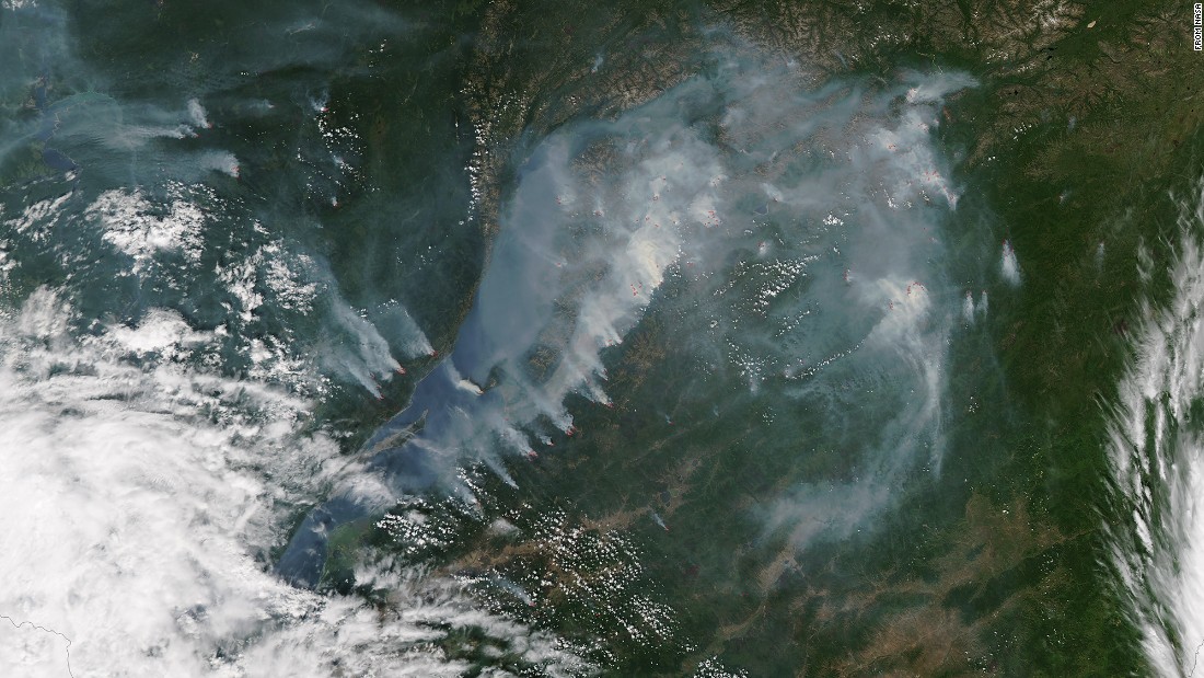 Smoke from fires near the shoreline of Russia&#39;s Lake Baikal was captured by NASA&#39;s Aqua satellite on July 27. The red spots show where fires were most active. Lake Baikal is the largest freshwater lake by volume in the world, but its water levels have dropped in recent months, according to the Reuters news agency.