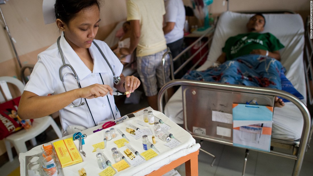 There is no drug for dengue. Patients must be monitored carefully for the onset of the severe form of dengue. Pictured, a nurse looks after a patient with dengue at a hospital in Manila, Philippines.