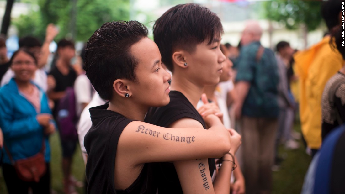 Two Marchers Enjoy Live Music During The Fourth Gay Pride -8009