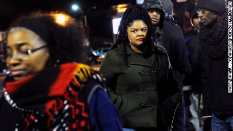 Johnetta Elzie, then 25, stands outside the Ferguson police station during a 2014 demonstration. 