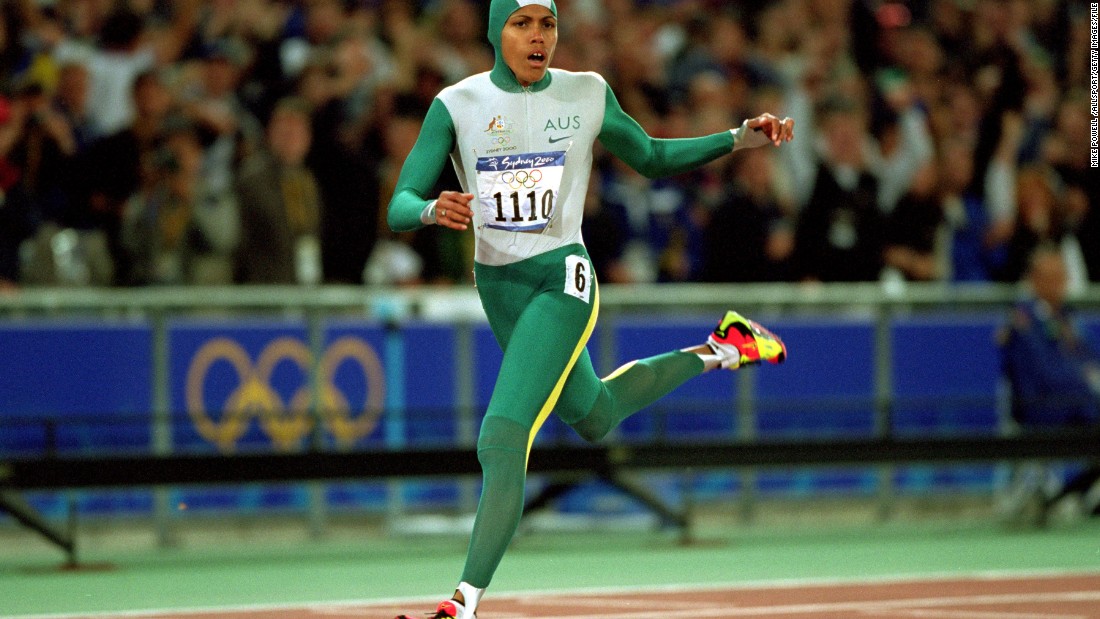 Cathy Freeman delighted Australian fans by winning the women&#39;s 400m, becoming the first athlete to light the Olympic torch and take a gold medal at the same Games.