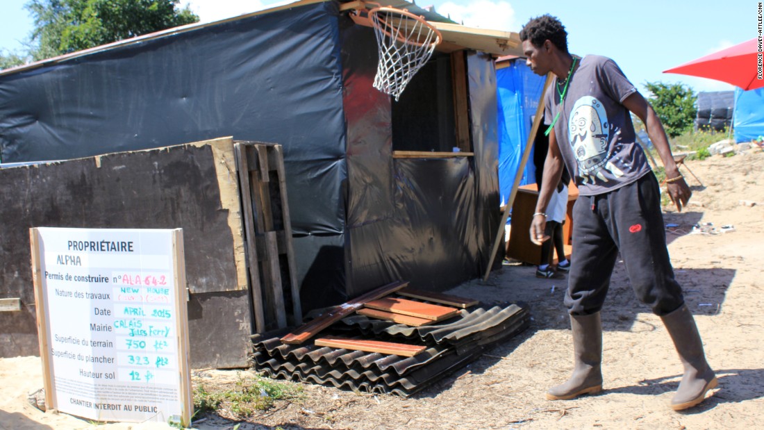 Some local residents, resigned to staying in the camp at least semipermanently, have taken jobs. This is Alpha, from North Africa, who has become the local builder. He uses materials donated by local French people.