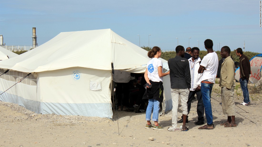 The hospital tent is run by Medecins du Monde. They see many broken arms and legs, as well as cuts and scrapes after people have tried to climb into trucks and over fences. They are also seeing scabies and respiratory infections from the living conditions in the camp and the dust.