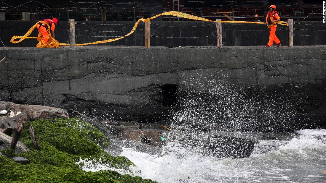 Taiwanese coast guard personnel block off coastal walkways in Keelung, Taiwan, on August 7.