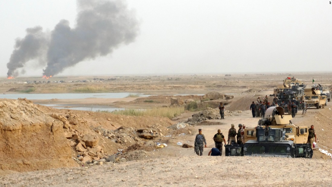 Smoke rises as Iraqi security forces bomb ISIS positions in the eastern suburbs of Ramadi, Iraq, on August 6.