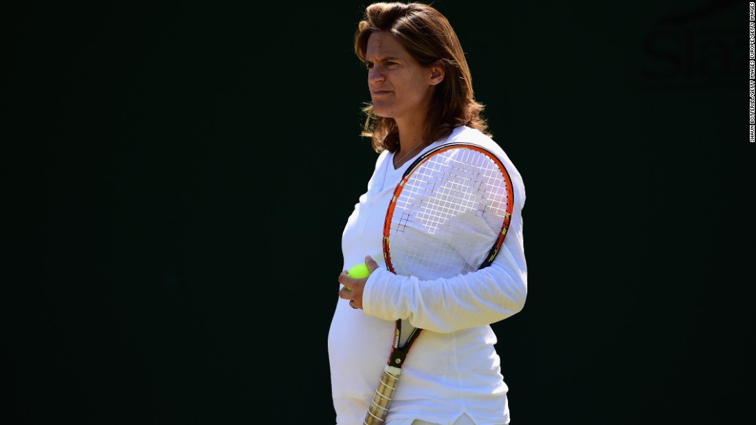 Heavily pregnant Coach Amelie Mauresmo looks on during a Wimbledon practice session for Andy Murray in July. Mauresmo is the first female to coach a top player on the men&#39;s tour. 