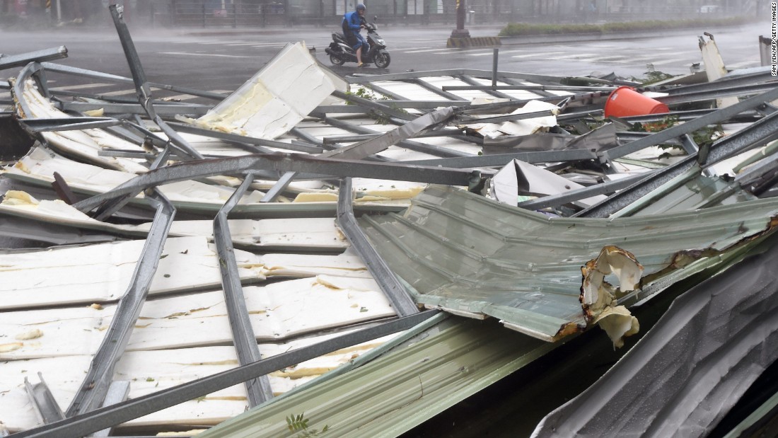 Metal sheeting lies on a Taipei road after the arrival of Typhoon Soudelor early on August 8. 