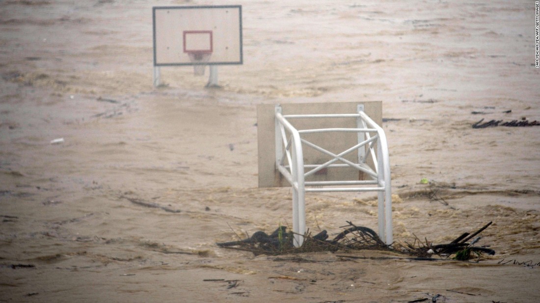 A basket stadium is flooded by the Jingmei River on August 8. More than 3 feet of rain fell in parts of Taiwan Saturday, CNN Meteorologist Ivan Cabrera said.