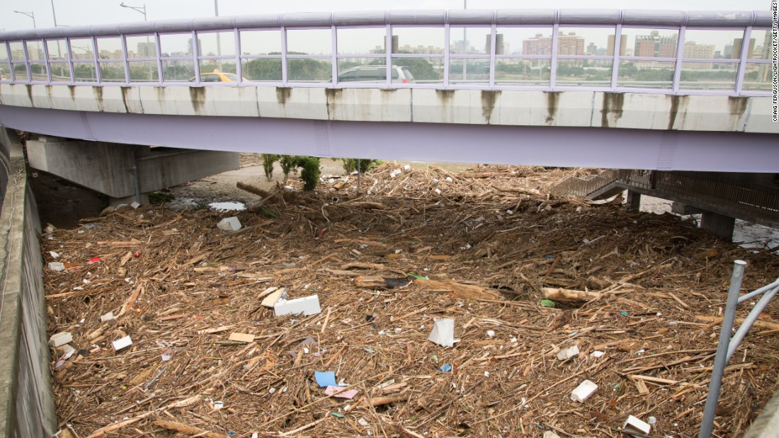 Tree branches and other debris lie under a bridge in Taipei, Taiwan, as a result of floods caused by Typhoon Soudelor. The storm brought widespread destruction to Taiwan after making landfall there in the early hours of Saturday. 