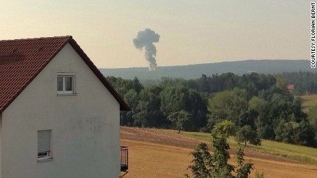 Smoke is visible in the distance where a U.S. F-16 crashed Tuesday in Germany&#39;s Bavaria region.