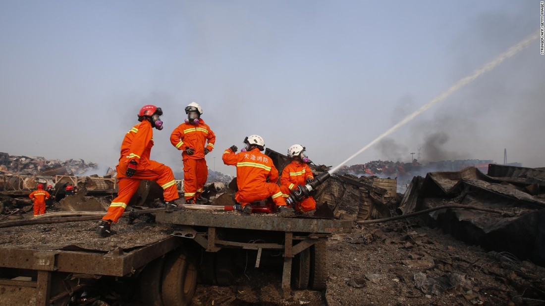 Firefighters work August 15 at the site of the explosions. 