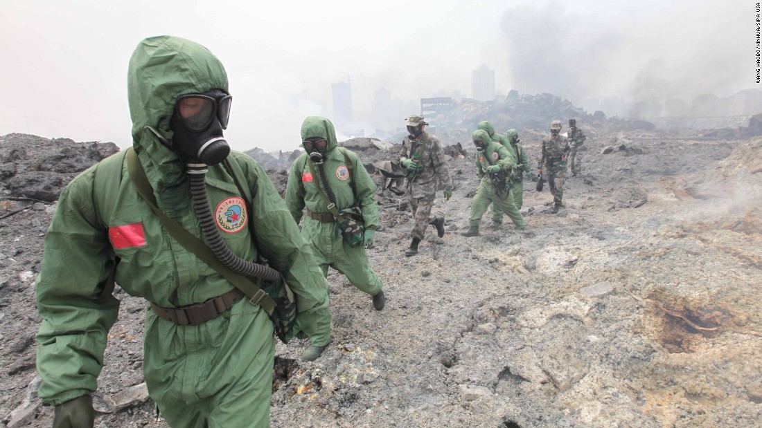 Soldiers from the National Nuclear Biochemical Emergency Rescue Team launch a rescue mission August 15 at the core area of the explosion site.