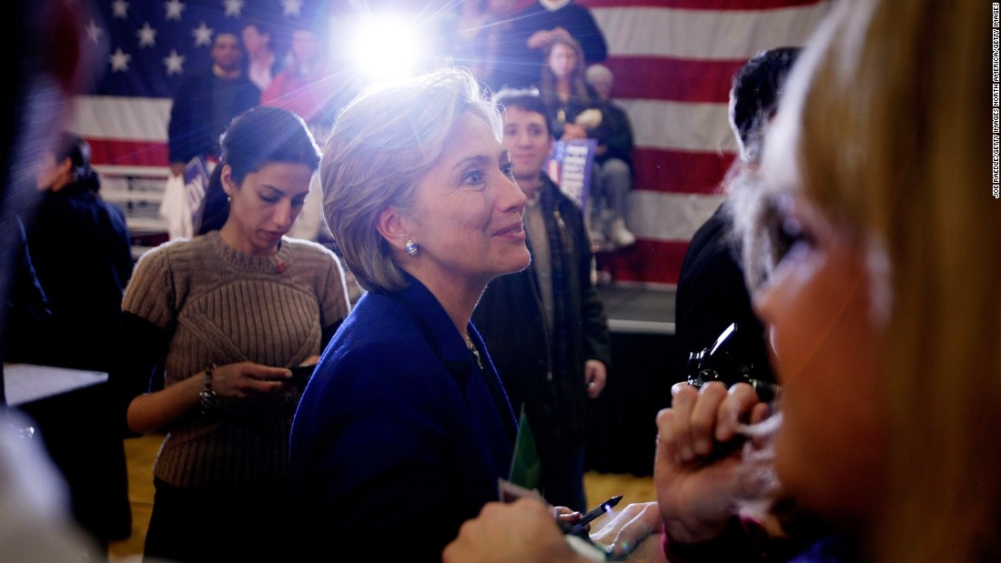 Clinton greets people during a campaign stop at The McConnell Center January 7, 2008 in Dover, New Hampshire, as Abedin stands behind her.