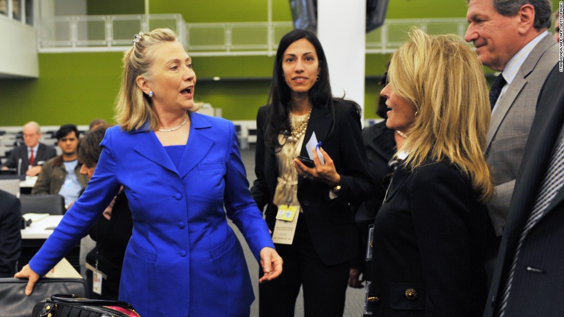 Clinton (left), accompanied by Abedin (center), greets people before a meeting on the Flood Emergency in Pakistan September 19, 2010 at United Nations headquarters in New York.