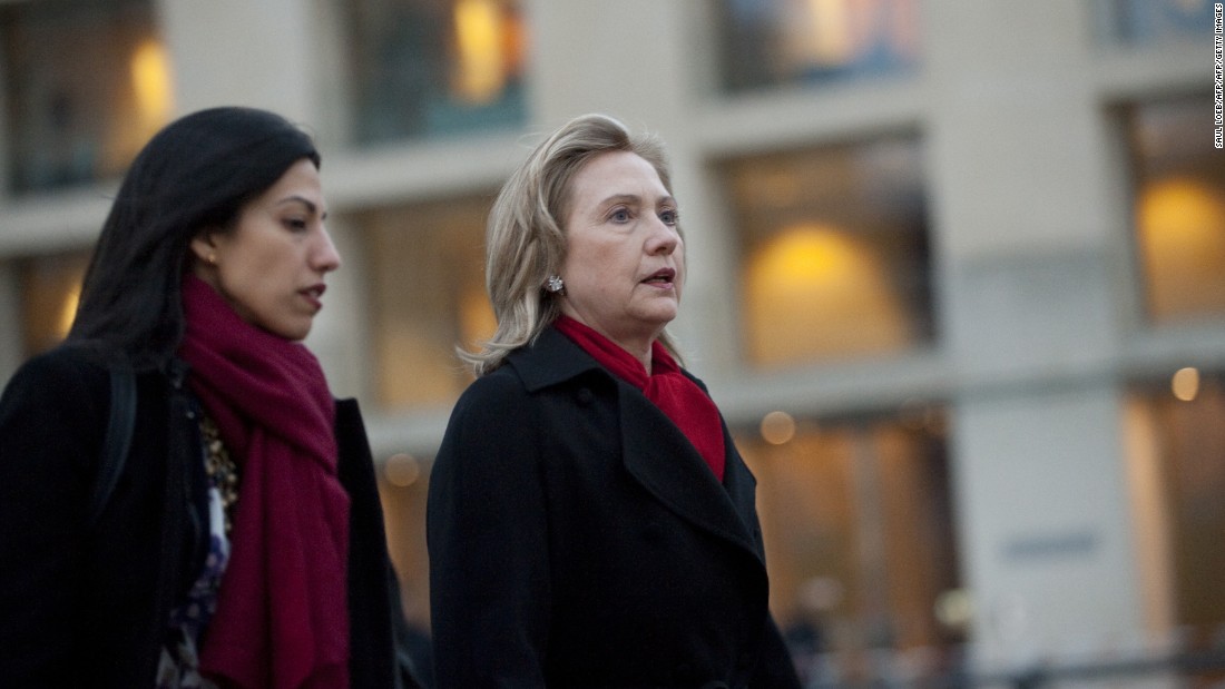 Clinton (right) and Abedin arrive for a NATO Foreign Minister family photo in front of the Brandenburg Gate in Berlin April 14, 2011.