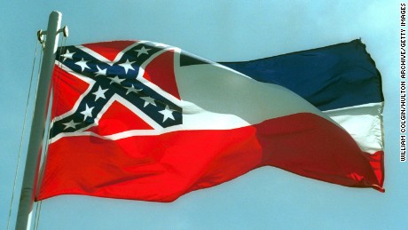 387975 02:  The Mississippi State flags flies April 17, 2001 in Pascagoula, MS. Voters will decide whether to replace the state&#39;s old flag, which sports the Confederate battle cross, with a new flag that would have 20 white stars on a blue square.  (Photo by Bill Colgin/Getty Images) 