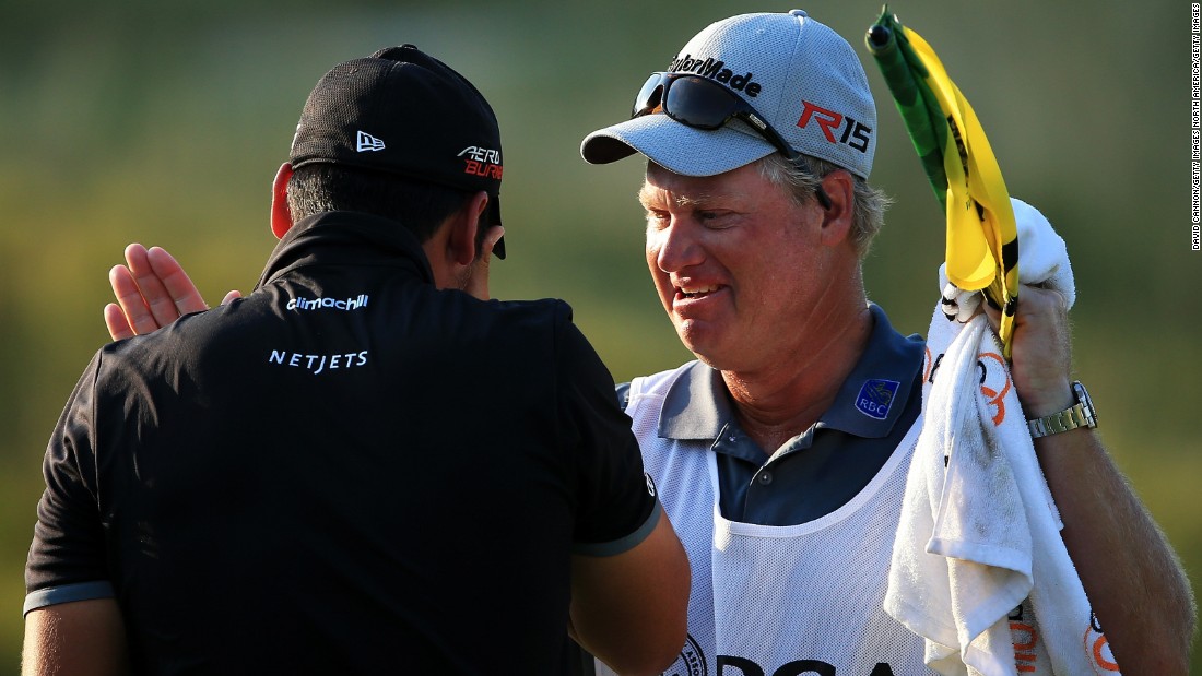 The tearful 27-year-old was congratulated by his longtime caddy and mentor Colin Swatton on the 18th green.