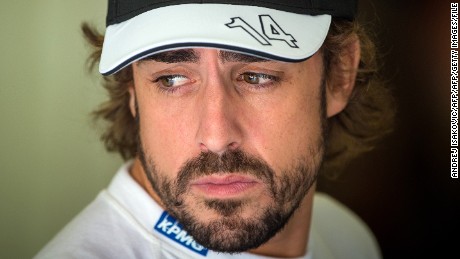 McLaren Honda&#39;s Spanish driver Fernando Alonso waits in the pits during the third practice session at the Hungaroring circuit  near Budapest on July 25, 2015, on the eve of the  Hungarian Formula One Grand Prix. AFP PHOTO / ANDREJ ISAKOVIC        (Photo credit should read ANDREJ ISAKOVIC/AFP/Getty Images)